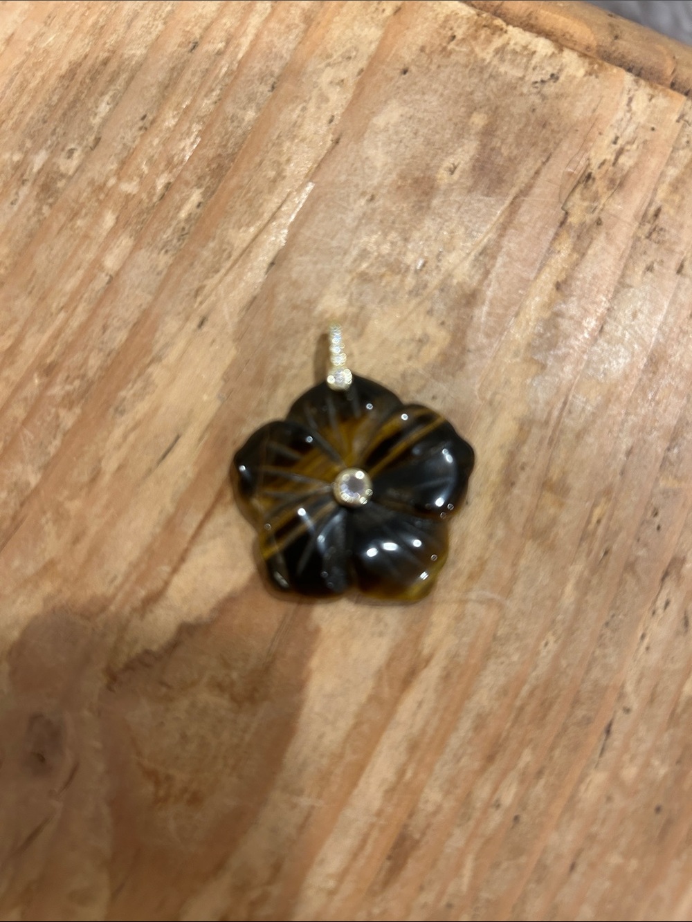Hand-Carved Black and Amber Flower Pendant with Crystal Accent